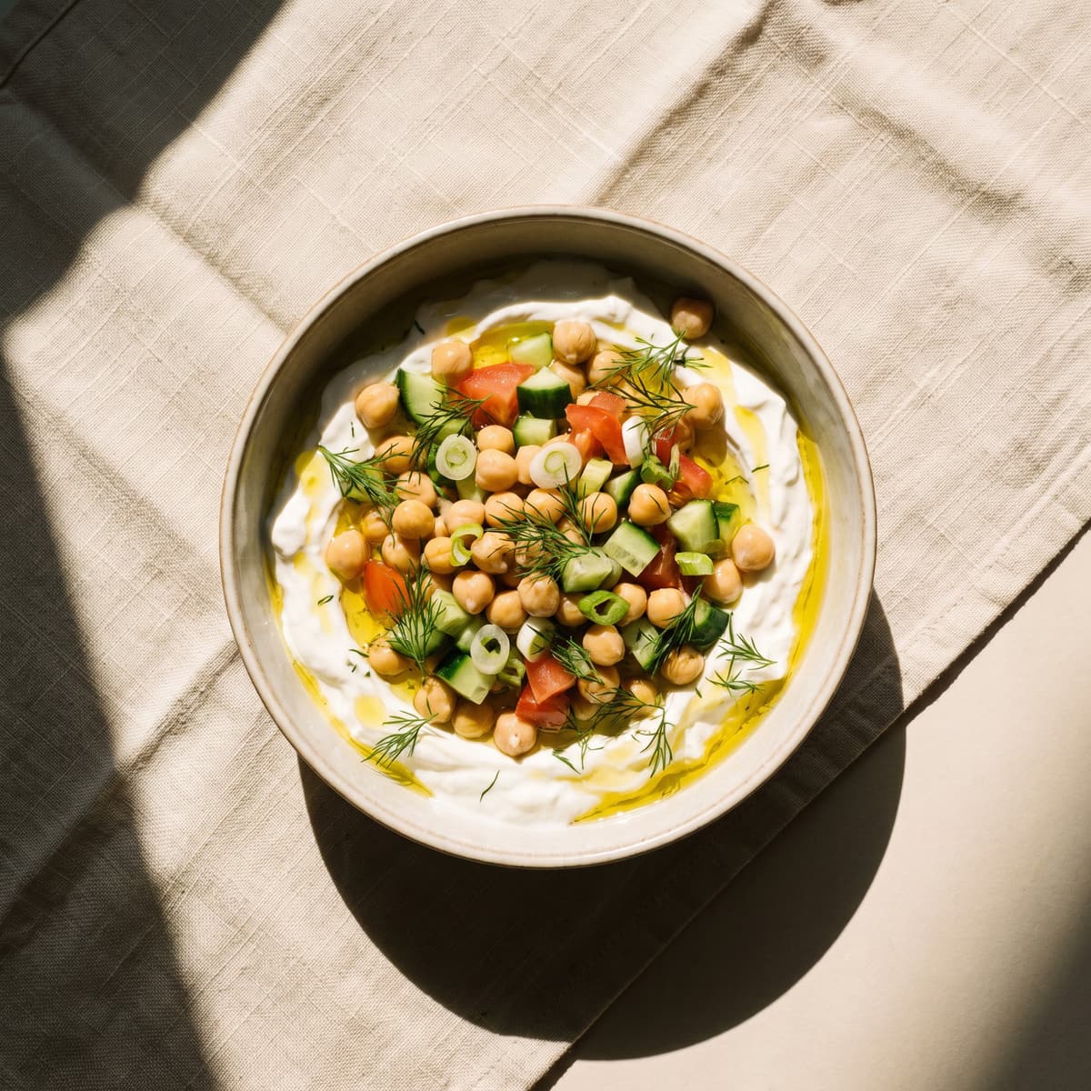 AI-generated photo: Savoury yogurt bowl with chickpeas, cucumber and tomato