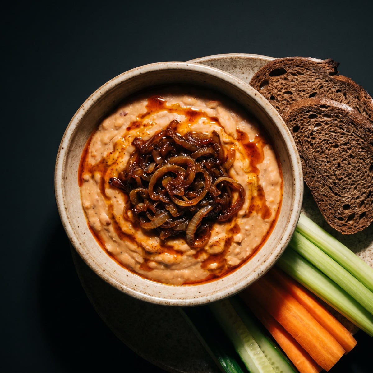 AI-generated photo: Romanian white bean dip with caramelized onions and sides
