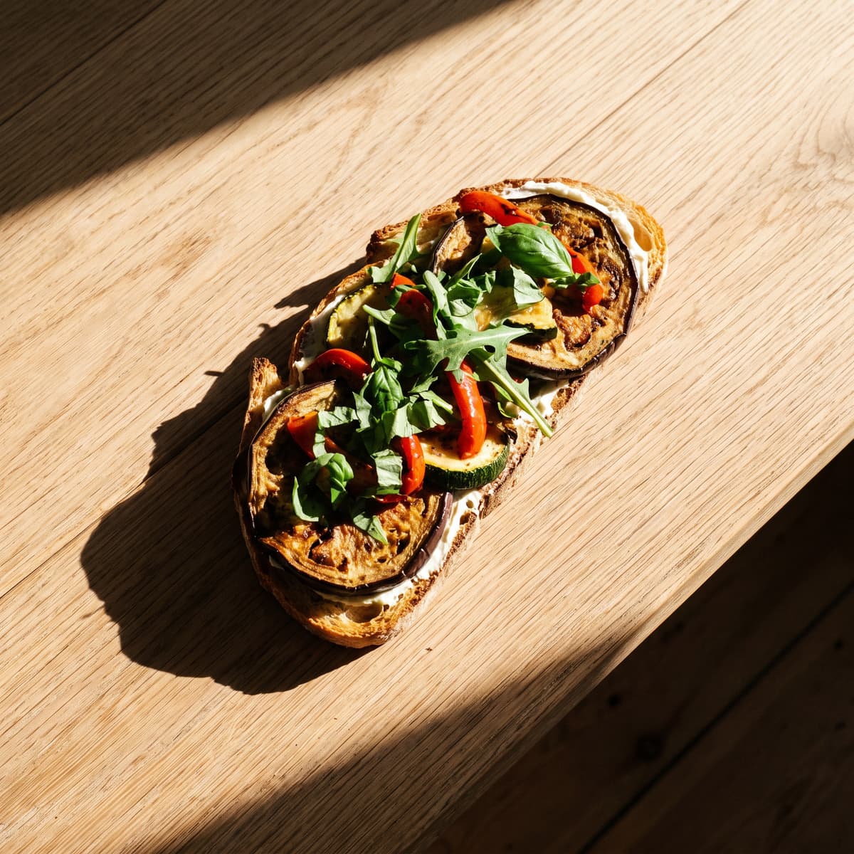 AI-generated photo: Roasted vegetable sandwich with cream cheese, basil and rocket