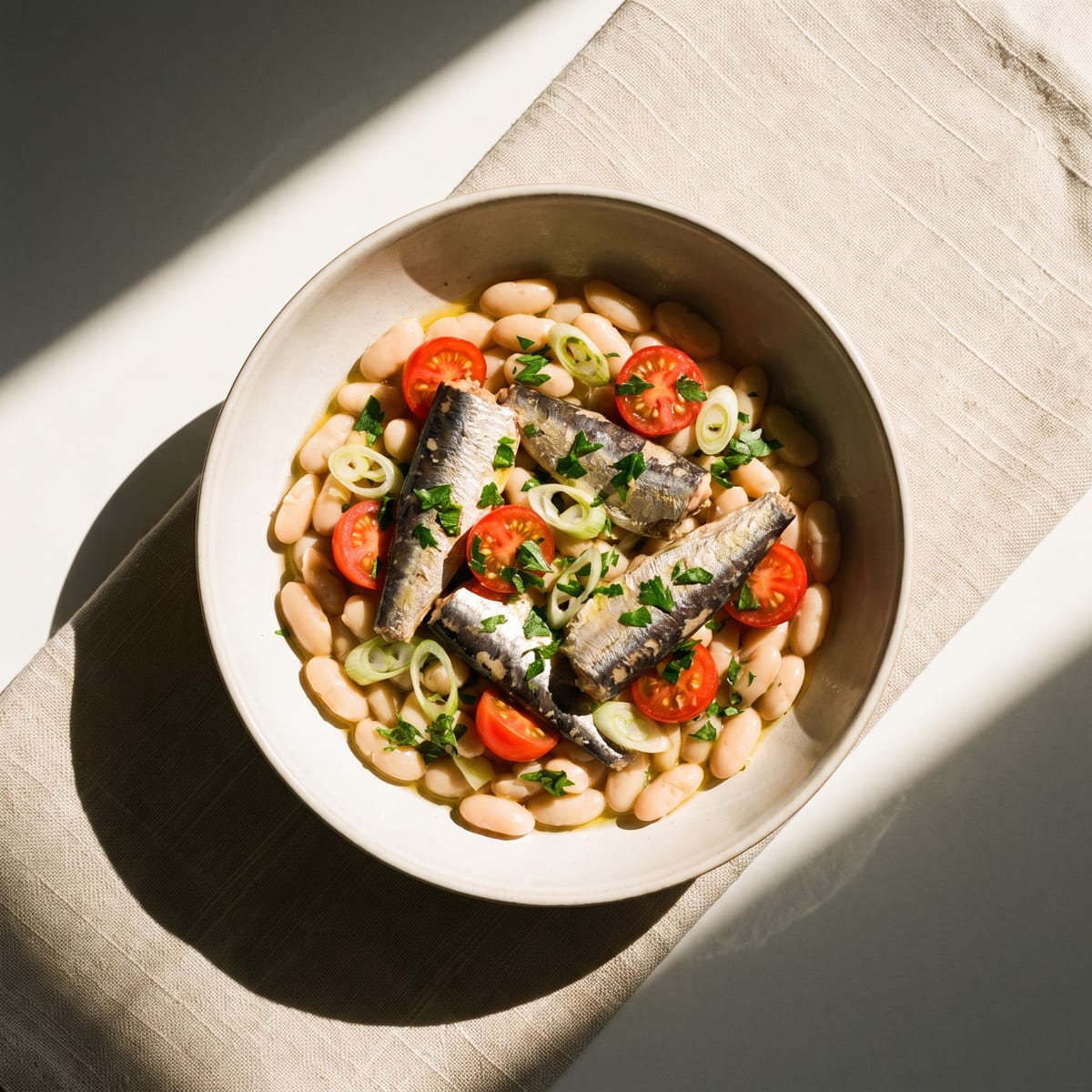 AI-generated photo: White beans and sardines with cherry tomatoes, parsley and lemon
